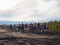 BROMO, INDONESIA - JULY 12, 2O17 : Tourists hiking up to the top of Mount Bromo, the active mount Bromo is one of the