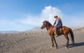 BROMO, INDONESIA - Sep 13: Unidentified workers wait horse rental for tourists at Mount Bromo on Sep 13, 2015 in Java, Indonesia.