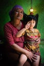 Nidentified old lady pose for camera with her grandchild at Cemoro Lawang