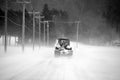 Tractor during snow storm in rural Bromont