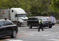 Female traffic officer directing vehicles at intersection Bronx NY