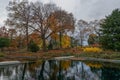Bronx, New York, USA: Trees and autumn leaves reflected in an outdoor pool