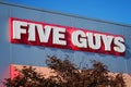 Five Guys fast food chain restaurant exterior name brand signage Royalty Free Stock Photo