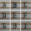 Bronz alphabet letter on wooden background. A, B, C, D, E, F, G, H, I Set 1 from 3, search others in portfolio