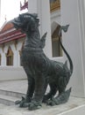 Bronz singha guarding the temple entrance