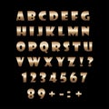 Bronze alphabet on a black background.