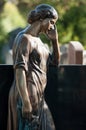 bronze angel on tomb in cemetery Royalty Free Stock Photo