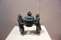 This bronze artifact depicts two figures in ancient costumes carrying a treasure basin Royalty Free Stock Photo