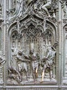Bronze bas-reliefs of the Pieta scene in bas-relief at Milan`s Cathedral doors Royalty Free Stock Photo