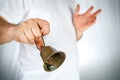 Bronze bell in hand