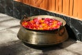 Bronze bowl with rose petals Royalty Free Stock Photo