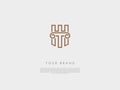 a bronze business logo that have an ancient column letter t and h and a piece of a wall of a castle at the background