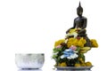 Bronze cast Buddha image decorate with beautiful flowers and garland for pray on Songkarn festival on white background Royalty Free Stock Photo