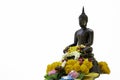 Bronze cast Buddha image decorate with beautiful flowers and garland for pray on Songkarn festival on white background Royalty Free Stock Photo