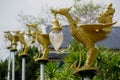 Bronze casting Thai literature swans carrying bell-shaped electricity lantern painted with gold colour