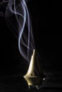 Bronze censer with bluish smoke Royalty Free Stock Photo