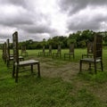 12 bronze chairs - Jurors artwork by Hew Locke in Runnymede, Surrey, UK