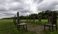 12 bronze chairs - Jurors artwork by Hew Locke in Runnymede, Surrey, UK