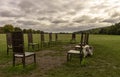 12 bronze chairs - Jurors artwork by Hew Locke in Runnymede, Surrey, UK