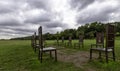 12 bronze chairs - Jurors artwork by Hew Locke in Runnymede, Surrey, UK