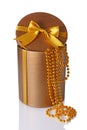 Bronze classic shiny round gift hat box with golden satin bow and beads Royalty Free Stock Photo