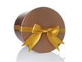 Bronze classic shiny round gift hat box with golden satin bow Royalty Free Stock Photo