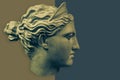 Plaster sculpture of woman face. Bronze color gypsum copy of ancient statue of Diana head for artists. Diana in Roman