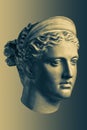 Bronze color gypsum copy ancient statue Diana head goddess of nature and hunting for artists on brass background