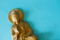 Bronze colored Buddha statuette Royalty Free Stock Photo