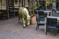 Bronze colored cow sculpture