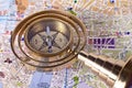 Bronze compass on a map Royalty Free Stock Photo