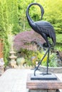 Bronze Crane Statue in Asian Inspired Garden Royalty Free Stock Photo