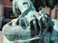 Bronze detailed lion claw over a snake