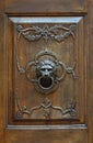 Bronze door handle in the shape of a lion`s head. Royalty Free Stock Photo