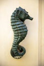 Bronze door knocker in the form of a seahorse Royalty Free Stock Photo