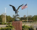 Bronze eagle sculpture on a brick pedestal in front of the Bank of Grand Lake in Langley, Oklahoma.