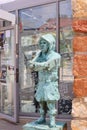 Bronze figure of a miner at the entrance to Olkusz Underground Museum in the middle of the square, Olkusz, Poland