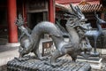 Bronze figures of a dragon and the deer - symbols of longevity a Royalty Free Stock Photo