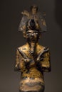 Bronze figurine of Osiris in sitting position from ancient Egypt. Egyptian god.