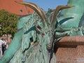 Bronze goat with red eyes, detail Neptune fountain in Berlin