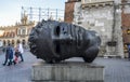Bronze head sculpture Eros Bendato by polish artist Igor Mitoraj on Market Square in Krakow, Poland