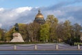 The Bronze Horseman is an equestrian statue of Peter the Great in the Senate Square.  Gold dome of St. Isaac`s Cathedral at the Royalty Free Stock Photo