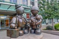 The bronze Immigrant Family sculpture by Tom Otterness on Yonge Street.