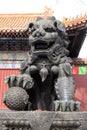 Bronze imperial lion at the gate of Lama Yonghe Temple in Beijing