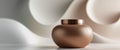Bronze jar sits on a glossy surface with a blurred abstract backdrop Royalty Free Stock Photo