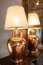 Bronze lamp on wood table.