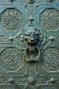 Bronze lion head door knocker on an old gate Royalty Free Stock Photo