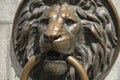 Bronze lion in the old town monument. brass ring Royalty Free Stock Photo