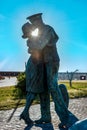 The Bronze Made Statue of A Sailor that Kisses a Lady in the Port of Civitavecchia, near Rome, Italy