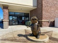 A bronze mascot Beaver Statue at a Buc ees